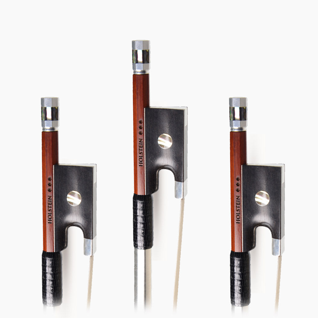 Three lined up Holstein violins pernambuco bows